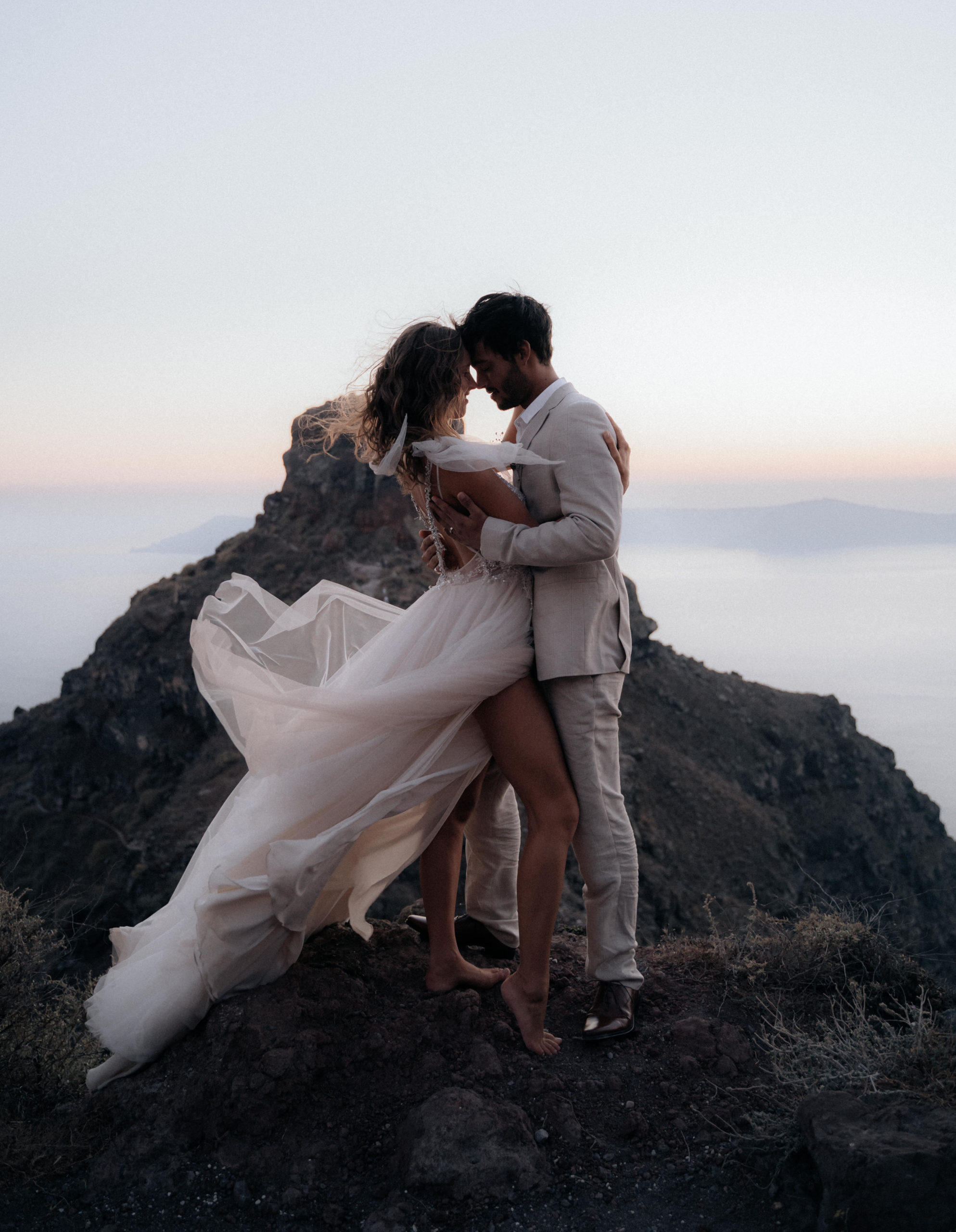 photo of bride and groom in santorini at sunset